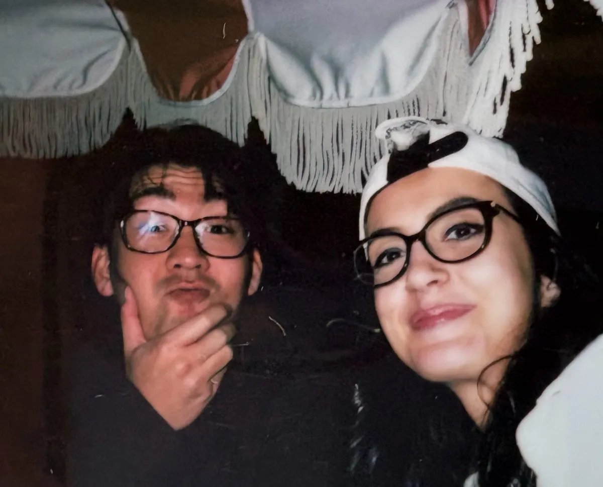 Two teammates wearing glasses, after-hours selfie