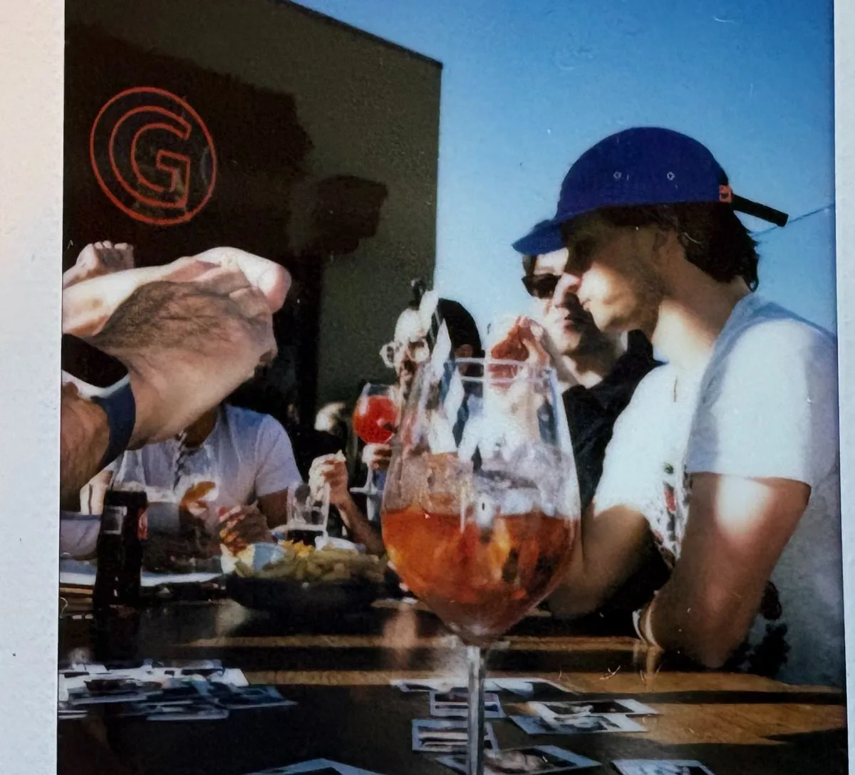 Rooftop afternoon with teammates around a long table